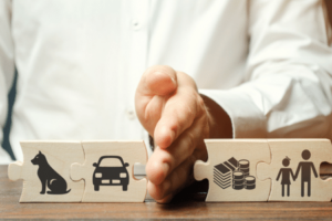 Man dividing blocks that represent property to show divorce challenges