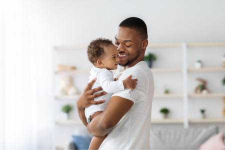 Happy father wondering how long it takes to establish paternity in Florida