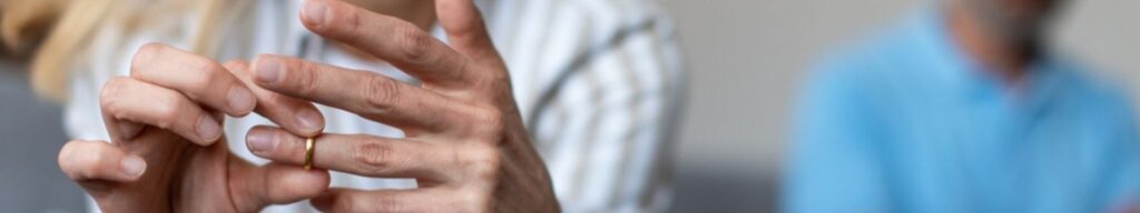 woman taking her ring off sitting away from husband to show legal separation vs divorce in pinellas county, florida