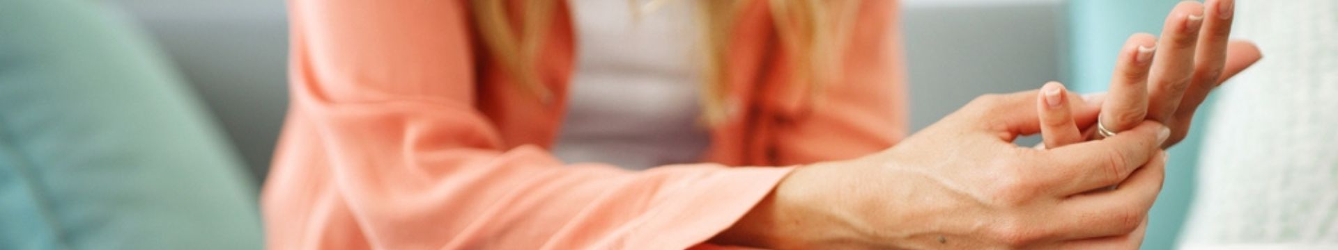 woman removing wedding ring while considering separation decisions.
